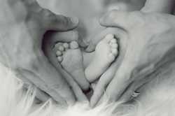 Thumbnail image for grayscale-photo-of-baby-feet-with-father-and-mother-hands-in-733881.jpg